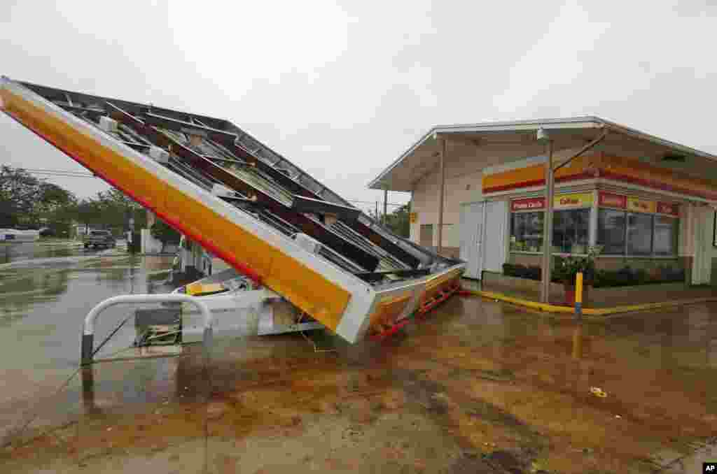 The metal canopy at a gasoline station is see on the ground after it was overturned by high winds brought on by Hurricane Irma, in North Miami, Florida, Sept. 10, 2017..