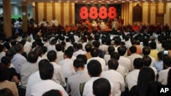  An activist speaks during a ceremony to mark the 24th anniversary of the Aug. 8, 1988, demonstrations in Rangoon, Burma. 