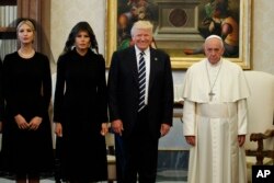 Ivanka Trump, first lady Melania Trump, and President Donald Trump stand with Pope Francis during a meeting, May 24, 2017, at the Vatican.