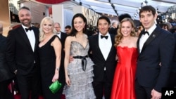 Evan Hayes, from left, Shannon Dill, Elizabeth Chai Vasarhelyi, Jimmy Chin, Sanni McCandless and Alex Honnold, from the cast and crew of "Free Solo," arrive at the Oscars on Sunday, Feb. 24, 2019, at the Dolby Theatre in Los Angeles. 