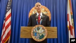 Florida Governor Rick Scott lays out his school safety proposal during a press conference at the Florida Capitol, in Tallahassee, Florida, Feb. 23, 2018.