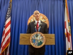 FILE - Florida Governor Rick Scott speaks during a press conference at the Florida Capitol, in Tallahassee, Florida, Feb. 23, 2018.