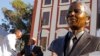 South African President Jacob Zuma (second l) talks with Mandla Mandela (l) after they and other dignitaries unveiled a bust of former South African President Nelson Mandela (r) at the South African Parliament in Cape Town, South Africa, April 28, 2014.