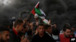 فلسطینی مظاہرین اسرائیل کی سرحد پر مظاہرہ کر رہے ہیں۔ 26 اکتوبر 2018