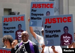 FILE - Rev. Anthony Evans, president of the National Black Church Initiative, speaks to the media during a demonstration asking for justice for Trayvon Martin, outside the Department of Justice in Washington, July 15, 2013.
