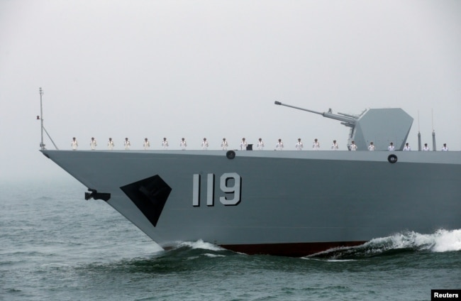 FILE - The Chinese navy’s guided missile destroyer Guiyang takes part in a naval parade off the eastern port city of Qingdao, April 23, 2019.