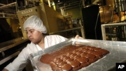 FILE - A chocolate factory worker.