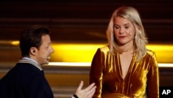 French DJ and musician Martin Solveig, left, talks to Olympique Lyonnais' Ada Hegerberg, of Norway, during the Golden Ball (Ballon d'Or) award ceremony at the Grand Palais in Paris, Dec.3, 2018. 