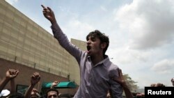 Protesters outside the Saudi embassy in Sana'a April 2, 2013 object to treatment of Yemenis in Saudi Arabia. Saudi Arabia is deporting thousands of Yemeni laborers during a crackdown on undocumented workers. Remittances bring in $2 billion a year to Yemen 