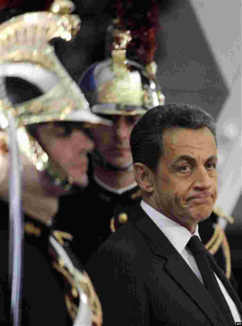 French President Nicolas Sarkozy waits for Chinese President Hu Jintao at the G20 summit in Cannes, Wednesday, Nov. 2, 2011. (AP Photo/Eric Feferberg, Pool)