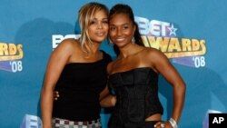 Tionne "T-Boz" Watkins, left, and Rozonda "Chilli" Thomas pose backstage at the BET Awards in Los Angeles.