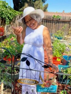 This photo shows Lagetta Wayne, 78, in her garden in Suisun City, Calif., on Aug. 10, 2021. Wayne is among a growing number of “grandfluencers,” folks 70 and up who are making names for themselves on social media. (KiKi Rose via AP)
