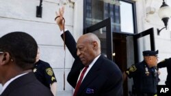Bill Cosby gestures as he leaves the Montgomery County Courthouse in Norristown, Pa., after being convicted of drugging and molesting a woman, Thursday, April 26, 2018. (AP Photo/Matt Slocum)