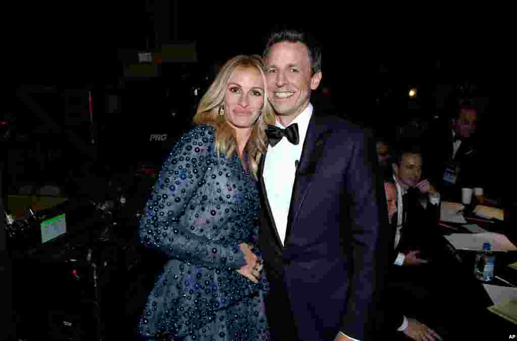 Julia Roberts and Seth Meyers backstage at the 66th Primetime Emmy Awards at the Nokia Theatre L.A. Live, Aug. 25, 2014, in Los Angeles.