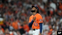 Houston Astros relief pitcher Cristian Javier leaves the game during the seventh inning in Game 2 of baseball's World Series between the Houston Astros and the Atlanta Braves, Oct. 27, 2021, in Houston. 