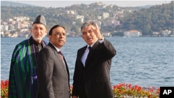Afghan President Hamid Karzai, left, Turkish President Abdullah Gul, right, and Pakistan President Asif Ali Zardari pose for a group photo after meetings in Istanbul, Turkey, November 1, 2011.