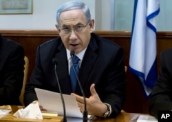 Israeli Prime Minister Benjamin Netanyahu speaks during in his Cabinet meeting in his office in Jerusalem, Nov. 23, 2014.