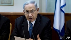 Israeli Prime Minister Benjamin Netanyahu speaks during in his Cabinet meeting in his office in Jerusalem, Nov. 23, 2014. 