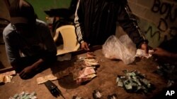 Traffickers sell drugs in the Antares slum in Rio de Janeiro, Brazil. 