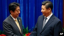 中國國家主席習近平和日本首相安倍晉三在亞太經合峰會期間舉行會晤。