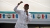 President Paul Kagame speaks at a rally outside of Kigali. (Z. Baddorf for VOA)