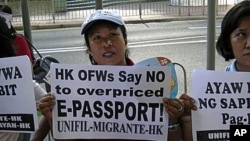 Filipino workers in Hong Kong protest e-passport fees