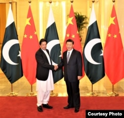 Pakistani Prime Minister Imran Khan with Chinese President Xi Jinping ahead of their meeting Nov. 2, 2018, in Beijing, China. (Pakistani Prime Minister's Office via Ayaz Gul)