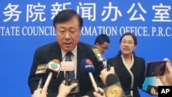 Yu Kangzhen, China's Vice President of Agriculture and Rural Affairs, answers questions at a press conference in Beijing on Thursday, July 4, 2019. (AP Photo/Sam McNeil)