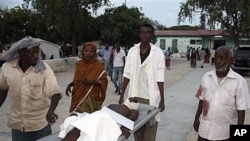 Wounded civilian at Madina hospital with injuries from roadside blast, Mogadishu, Somalia, Nov, 22, 2011.