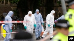 Forensic police investigate an area in the London Bridge area of London, June 5, 2017.