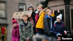 People attend the Fridays for Future march during the UN Climate Change Conference (COP26), in Glasgow, Scotland, Britain, Nov. 5, 2021.