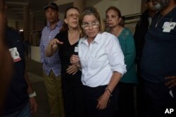 FILE - Mayor Carmen Yulin Cruz arrives at San Francisco hospital in Rio Piedras area of San Juan, Puerto Rico, Sept. 30, 2017.