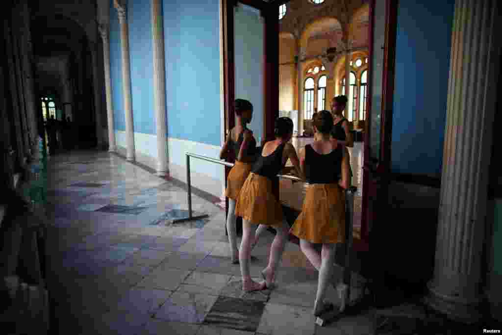 Students at the Cuba's National Ballet School chat during a break in Havana.