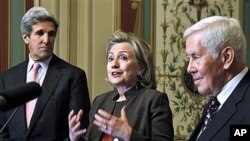 Secretary of State Hillary Rodham Clinton, center, flanked by Sen. John Kerry, D-Mass., left, and Sen. Richard Lugar, R-Ind., talks about the START Treaty following their meeting on Capitol Hill in Washington, 17 Nov 2010