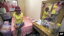 Taiwan-born sex worker Niko, 47, poses for a photograph after an interview with Reuters inside a brothel in Taipei (file photo)