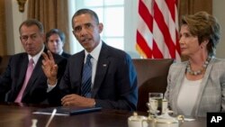 President Barack Obama, flanked by House Speaker John Boehner of Ohio (L) and House Minority Leader Nancy Pelosi of California, speaks to the media before a meeting at the White House with lawmakers on the situation in Syria.