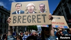 People hold banners during a 'March for Europe' demonstration against Britain's decision to leave the European Union, in central London, Britain, July 2, 2016. 