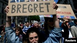 FILE - People hold banners during a 'March for Europe' demonstration against Britain's decision to leave the European Union, in central London, Britain, July 2, 2016. (REUTERS/Neil Hall)