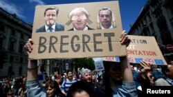 People hold banners during a 'March for Europe' demonstration against Britain's decision to leave the European Union, in central London, Britain, July 2, 2016. 