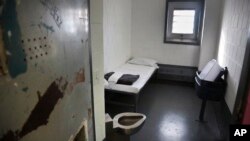 FILE - A Jan. 28, 2016, photo shows a solitary confinement cell known as "the bing," at New York's Rikers Island jail.