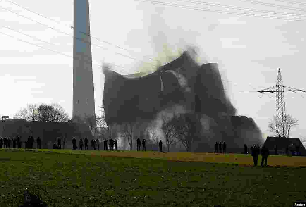 A disused coal-fired power station is destroyed via controlled explosion in Castrop Rauxel, Germany.