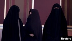 FILE - Veiled Iranian women are seen in Tehran, Iran, Feb. 24, 2016. 