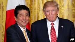 President Donald Trump and Japanese Prime Minister Shinzo Abe shake hands following their joint news conference in the White House in Washington, Feb. 10, 2017. 