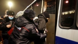 Law enforcement officers detain a participant of a rally to protest the detainment of Russian opposition leader Alexei Navalny, in Saint Petersburg, Russia January 18, 2021. REUTERS/Anton Vaganov