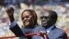 Zimbabwe President Robert Mugabe and his wife Grace arrive for his inauguration as President, in Harare, August 22, 2013. 