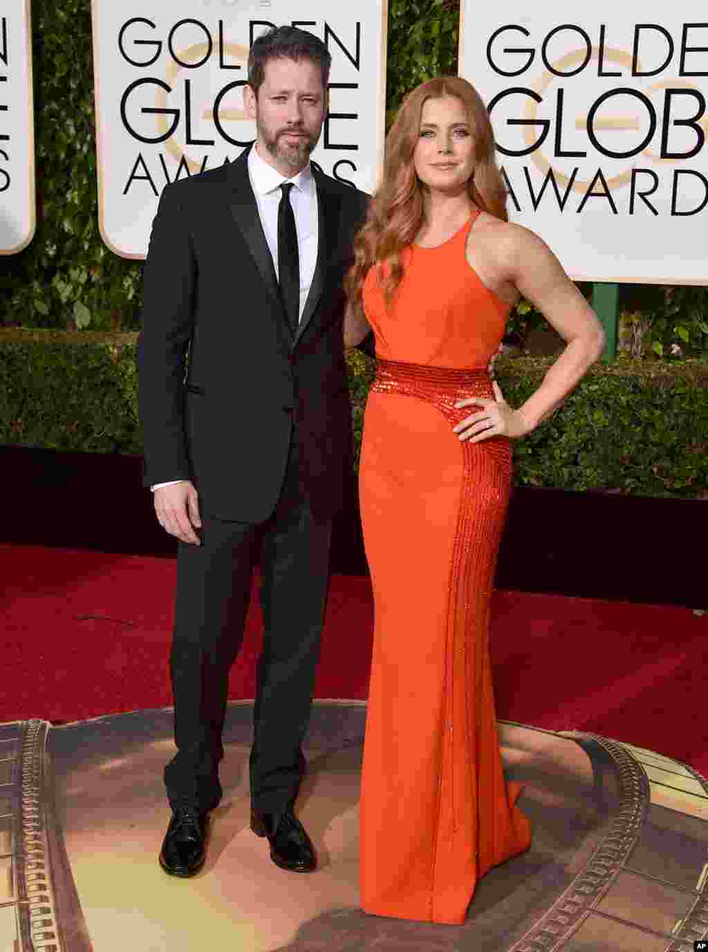 Darren Le Gallo, left, and Amy Adams arrive at the 73rd annual Golden Globe Awards on Jan. 10, 2016, at the Beverly Hilton Hotel in Beverly Hills, Calif.