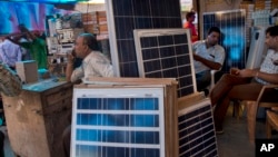 Solar panels are displayed for sale at a market in New Delhi, India, October 1, 2015.