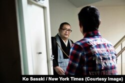 Junku Soto, a Buddhist priest, being greeted by a client. Credit Ko Sasaki for The New York Times