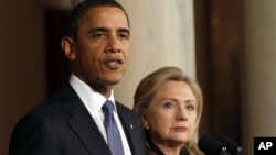 FILE - President Barack Obama with U.S. Secretary of State Hillary Clinton at the White House in 2011