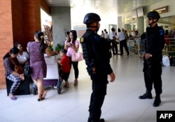 Indonesian Special Police patrol at Ngurah Rai Airport in Denpasar on Indonesia's resort island of Bali, Jan. 15, 2016, one day after a series of explosions hit the Indonesian capital Jakarta.